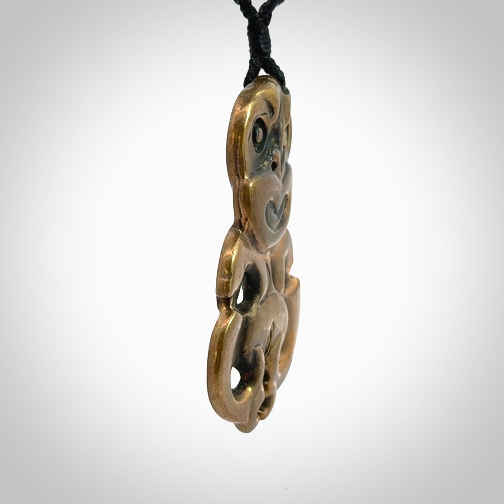 A beautiful hand made, bronze tiki pendant.