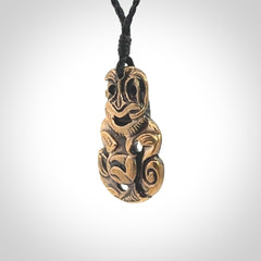 A beautiful hand made, bronze tiki pendant.