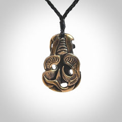 A beautiful hand made, bronze tiki pendant.