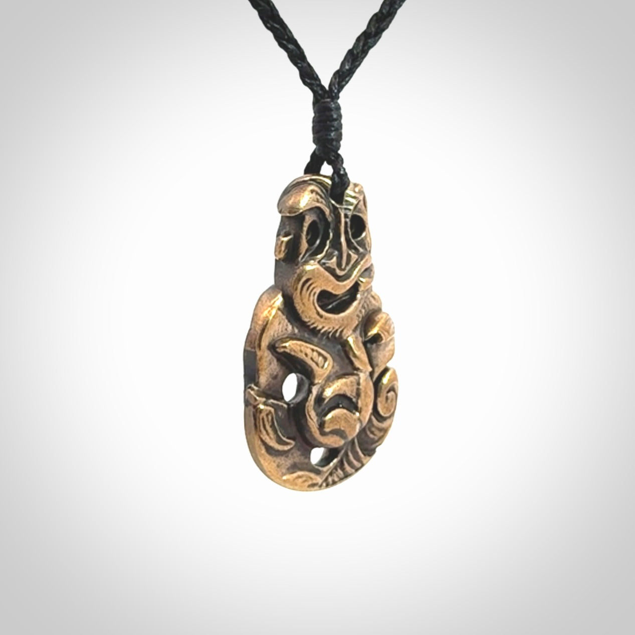 A beautiful hand made, bronze tiki pendant.