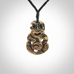 A beautiful hand made, bronze tiki pendant.