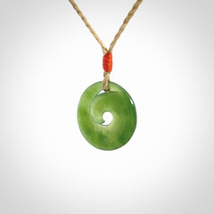 This little pendant is a beautifully carved, small jade koru pendant. Hand Carved for NZ Pacific by Graeme Wylie. Jade jewelry for sale online exclusively with NZ Pacific.