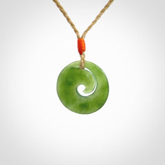 This little pendant is a beautifully carved, small jade koru pendant. Hand Carved for NZ Pacific by Graeme Wylie. Jade jewelry for sale online exclusively with NZ Pacific.
