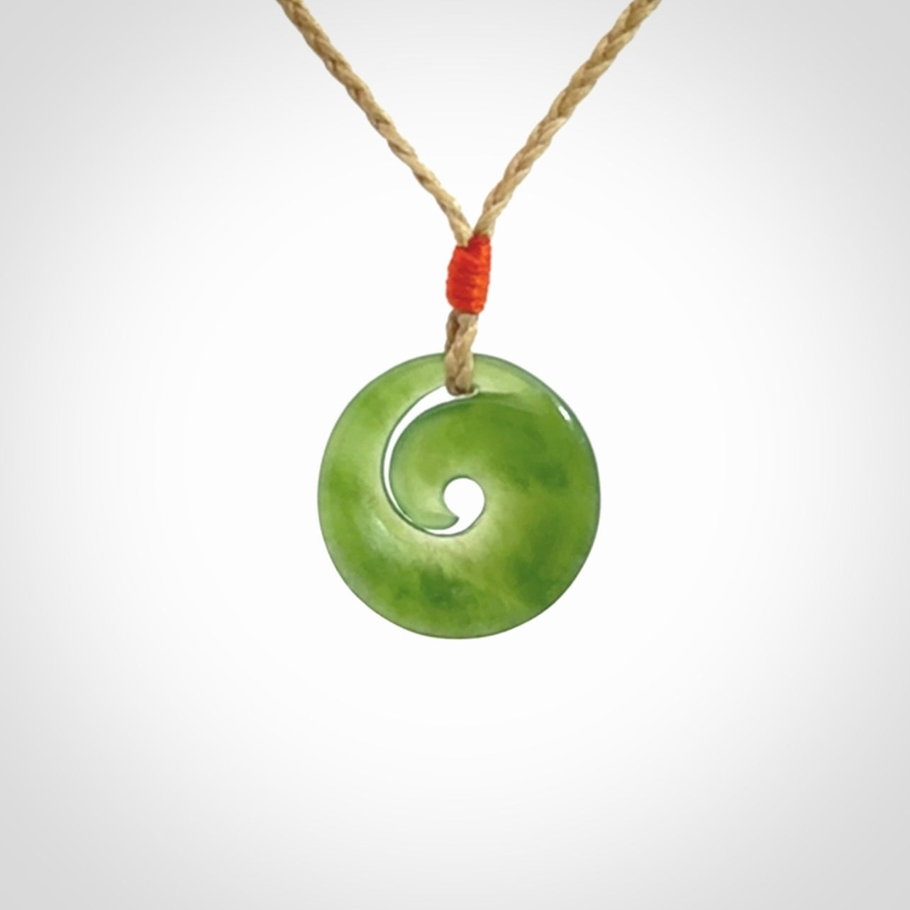 This little pendant is a beautifully carved, small jade koru pendant. Hand Carved for NZ Pacific by Graeme Wylie. Jade jewelry for sale online exclusively with NZ Pacific.