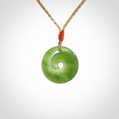 This little pendant is a beautifully carved, small jade koru pendant. Hand Carved for NZ Pacific by Graeme Wylie. Jade jewelry for sale online exclusively with NZ Pacific.