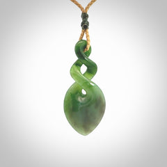 Hand carved New Zealand jade twist pendant. Carved in New Zealand by NZ Pacific. Unique double twist jewellery for sale online. Provided with an adjustable tan cord.