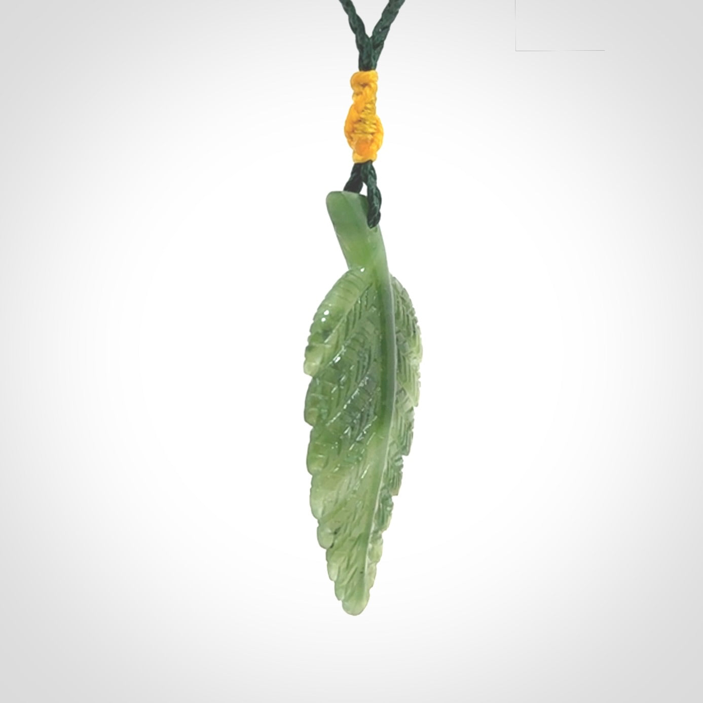 A delicate green jade fern leaf pendant with an adjustable neck cord. Green stone fern leaf necklace with adjustable cord. Delivery included.