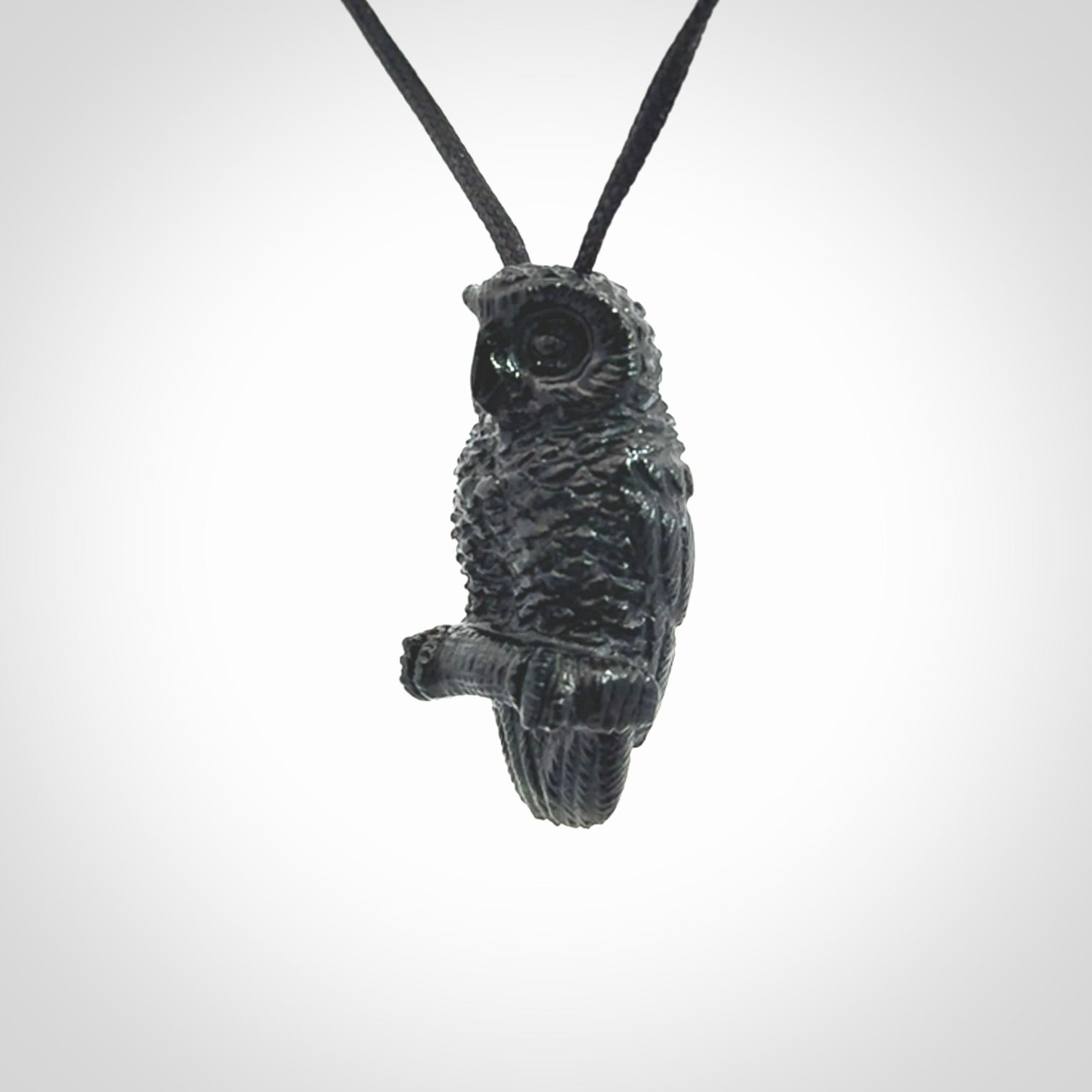 A traditional Owl design carving, hand made for us from Australian Black Jade. This is a work of art and is a collectable piece of traditional Black Jade carving. It can be worn as a special piece of jewellery or displayed. This is art made to wear at its finest. A unisex pendant for owl lovers. This pendant is provided with an adjustable cord.