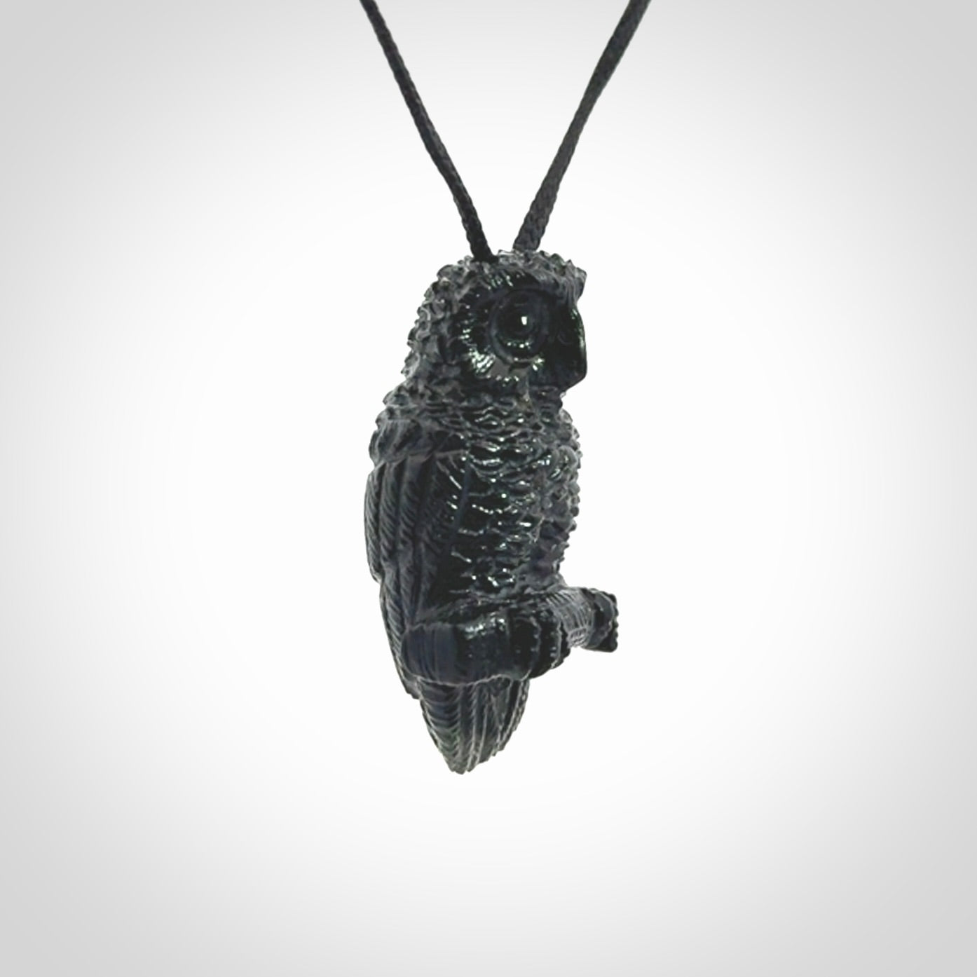A traditional Owl design carving, hand made for us from Australian Black Jade. This is a work of art and is a collectable piece of traditional Black Jade carving. It can be worn as a special piece of jewellery or displayed. This is art made to wear at its finest. A unisex pendant for owl lovers. This pendant is provided with an adjustable cord.