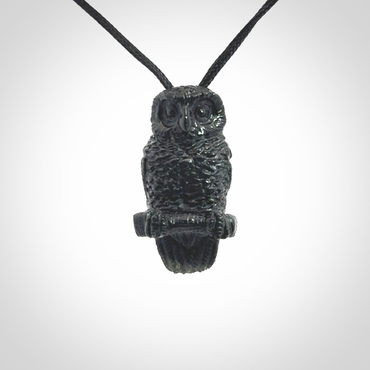 A traditional Owl design carving, hand made for us from Australian Black Jade. This is a work of art and is a collectable piece of traditional Black Jade carving. It can be worn as a special piece of jewellery or displayed. This is art made to wear at its finest. A unisex pendant for owl lovers. This pendant is provided with an adjustable cord.