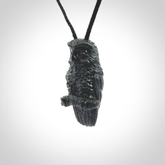 A traditional Owl design carving, hand made for us from Australian Black Jade. This is a work of art and is a collectable piece of traditional Black Jade carving. It can be worn as a special piece of jewellery or displayed. This is art made to wear at its finest. A unisex pendant for owl lovers. This pendant is provided with an adjustable cord.