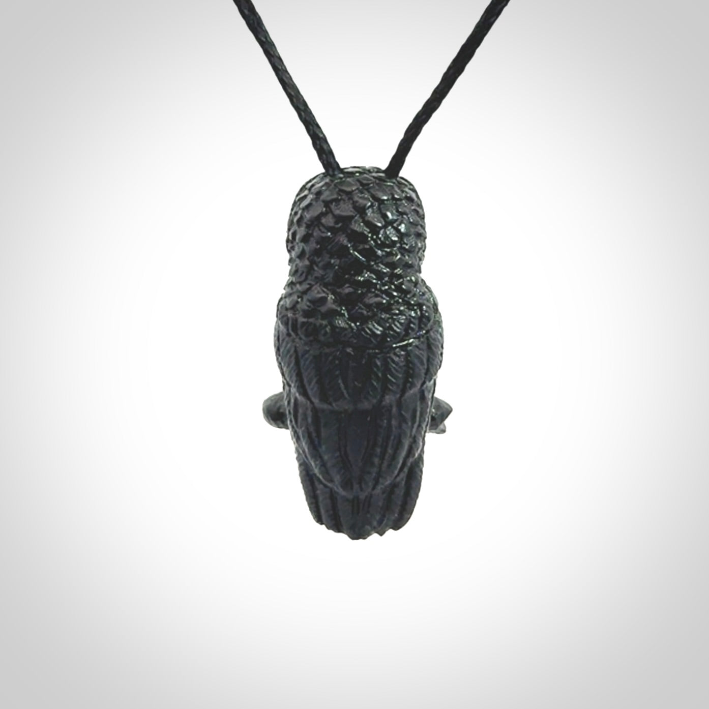 A traditional Owl design carving, hand made for us from Australian Black Jade. This is a work of art and is a collectable piece of traditional Black Jade carving. It can be worn as a special piece of jewellery or displayed. This is art made to wear at its finest. A unisex pendant for owl lovers. This pendant is provided with an adjustable cord.
