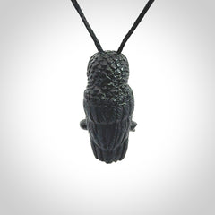 A traditional Owl design carving, hand made for us from Australian Black Jade. This is a work of art and is a collectable piece of traditional Black Jade carving. It can be worn as a special piece of jewellery or displayed. This is art made to wear at its finest. A unisex pendant for owl lovers. This pendant is provided with an adjustable cord.