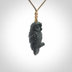 A traditional Owl design carving, hand made for us from Australian Black Jade. This is a work of art and is a collectable piece of traditional Black Jade carving. It can be worn as a special piece of jewellery or displayed. This is art made to wear at its finest. A unisex pendant for owl lovers. This pendant is provided with an adjustable cord.