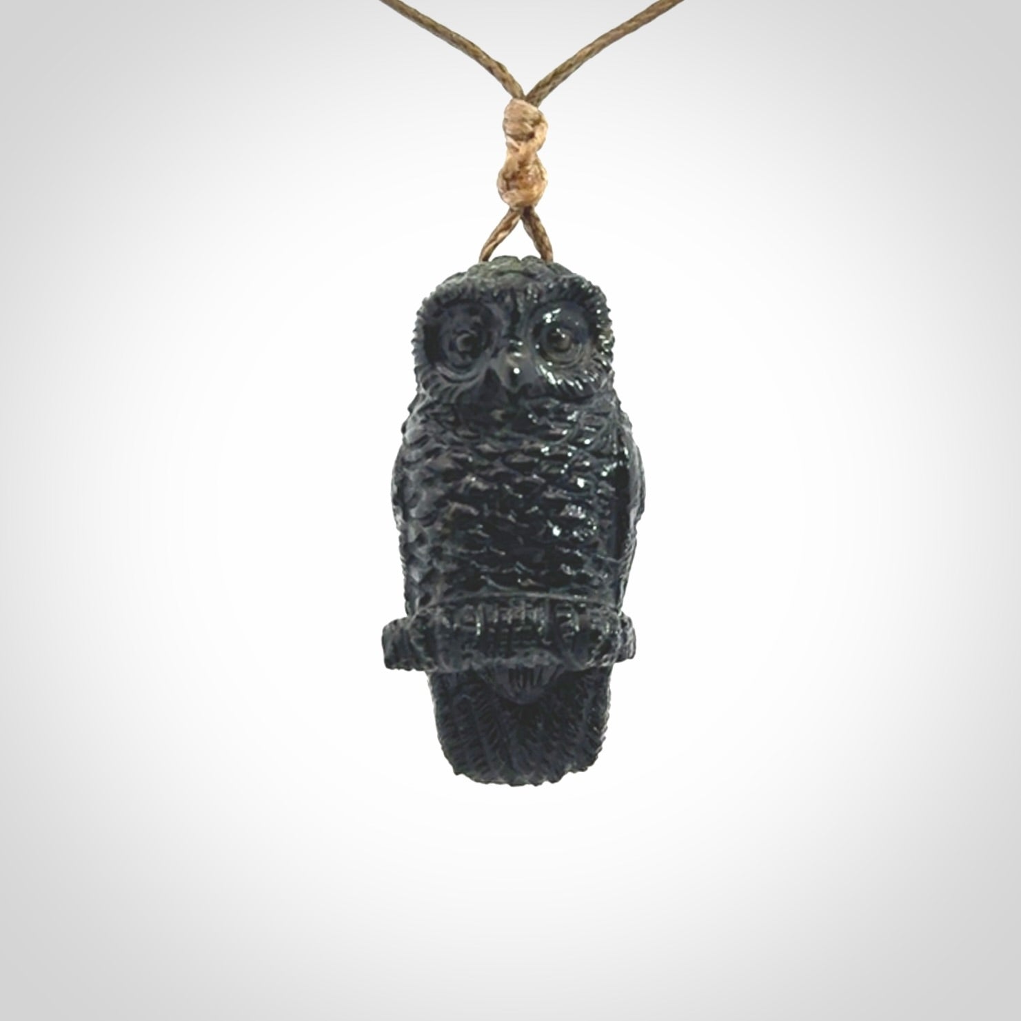 A traditional Owl design carving, hand made for us from Australian Black Jade. This is a work of art and is a collectable piece of traditional Black Jade carving. It can be worn as a special piece of jewellery or displayed. This is art made to wear at its finest. A unisex pendant for owl lovers. This pendant is provided with an adjustable cord.