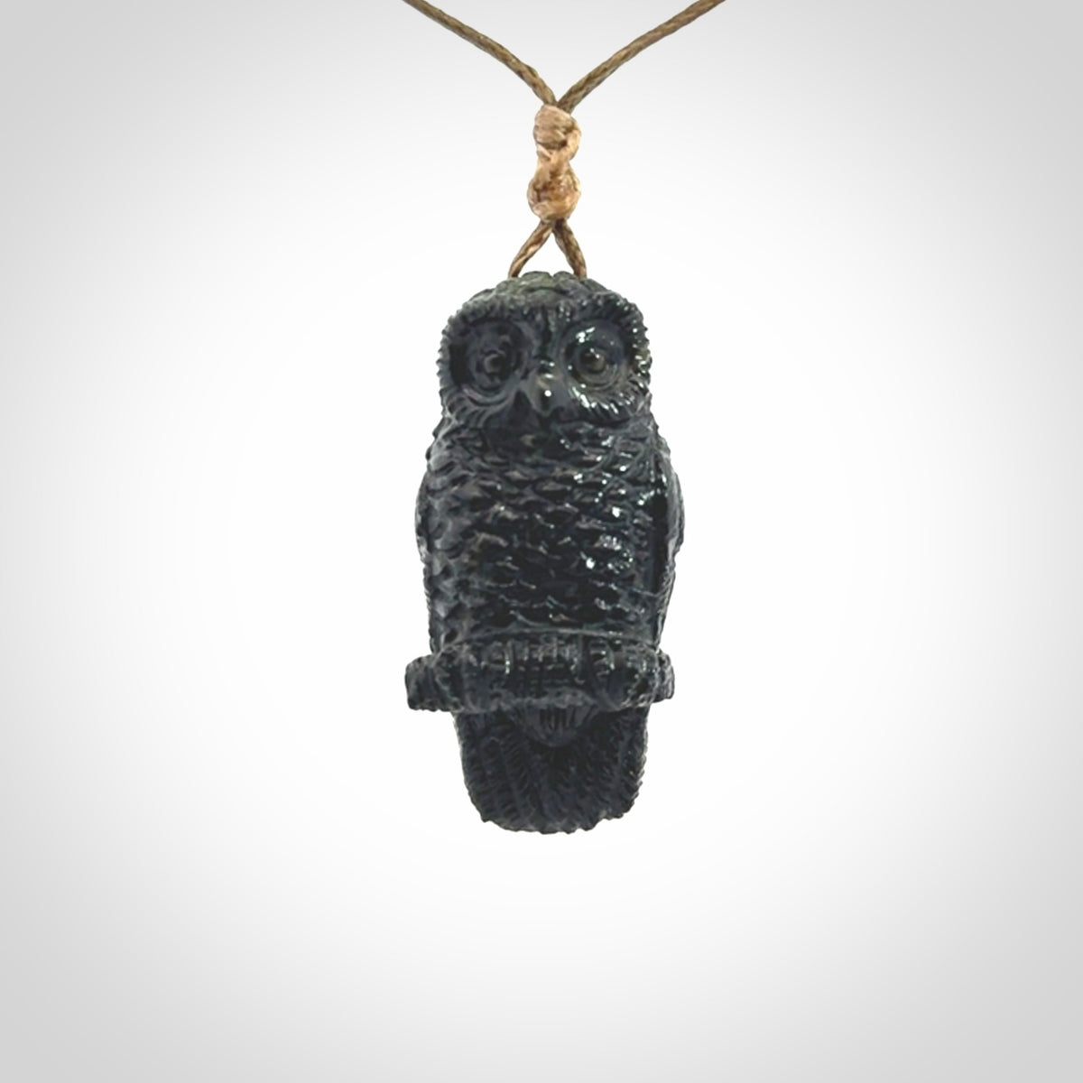 A traditional Owl design carving, hand made for us from Australian Black Jade. This is a work of art and is a collectable piece of traditional Black Jade carving. It can be worn as a special piece of jewellery or displayed. This is art made to wear at its finest. A unisex pendant for owl lovers. This pendant is provided with an adjustable cord.