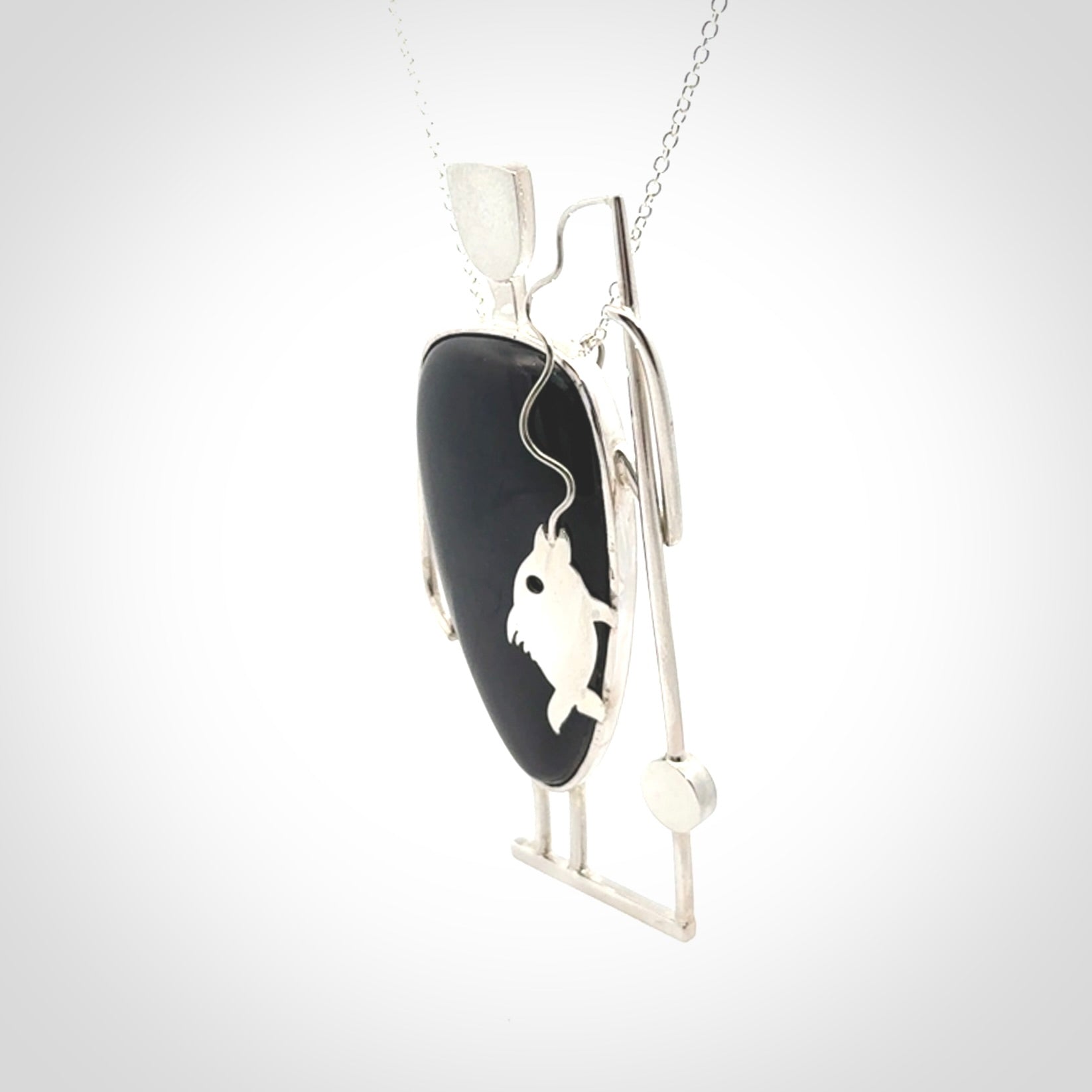 This is a very cool and creative fisherman hand made from Australian Black Jade and Sterling Silver. A fisherman who had caught a fish pendant hand crafted from sterling silver with Black Jade torso. A spectacular piece of art to wear with sterling silver chain.