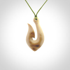 A fish hook necklace (hei-matau) hand-carved in a traditional style from Woolly Mammoth Tusk. These are glorious pieces of art to wear. Provided with adjustable cords and packaged in a woven kete pouch. Delivered with express courier.