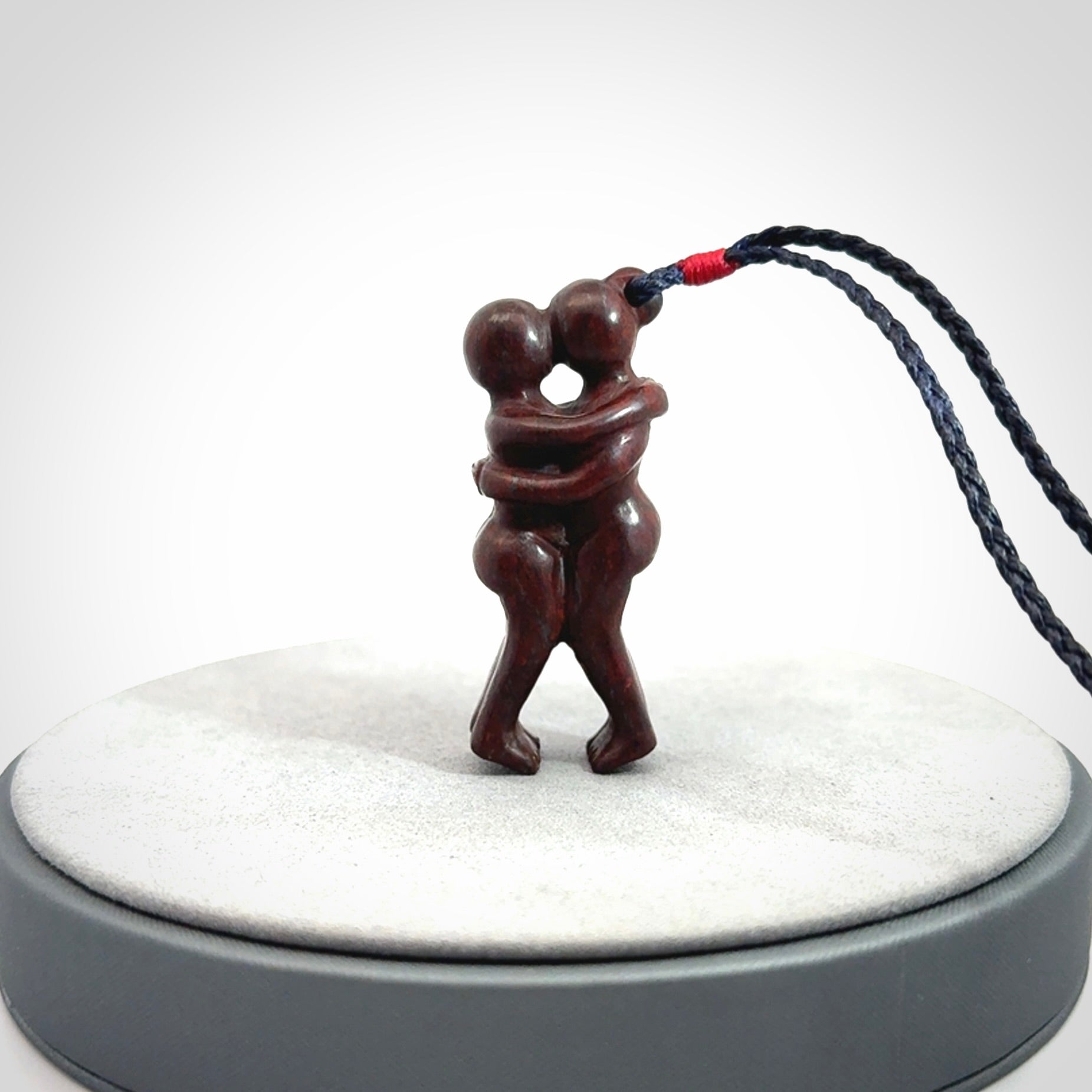 Hand carved Jasper hugging couple pendant