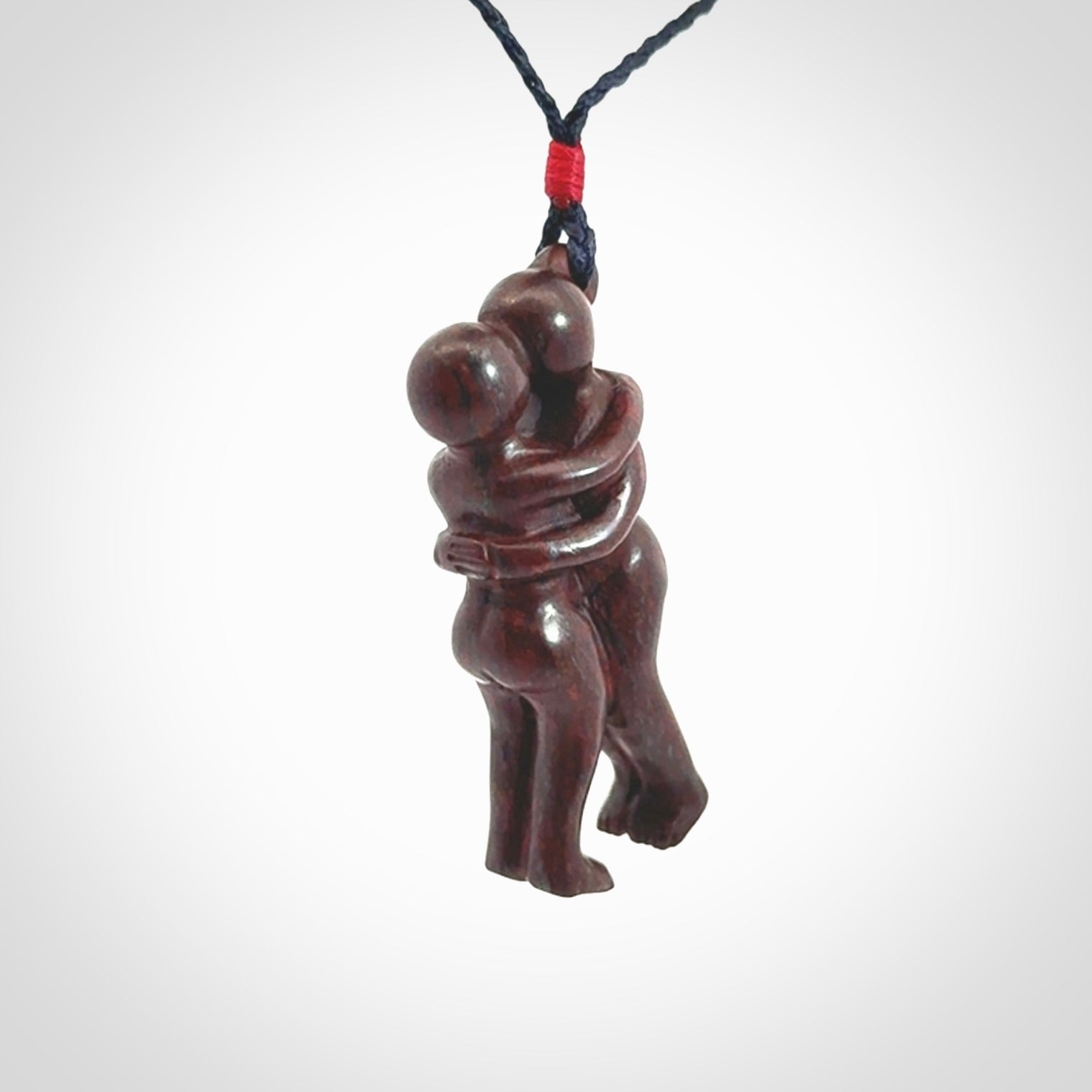 Hand carved Jasper hugging couple pendant