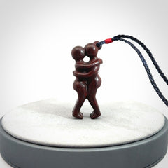Hand carved Jasper hugging couple pendant