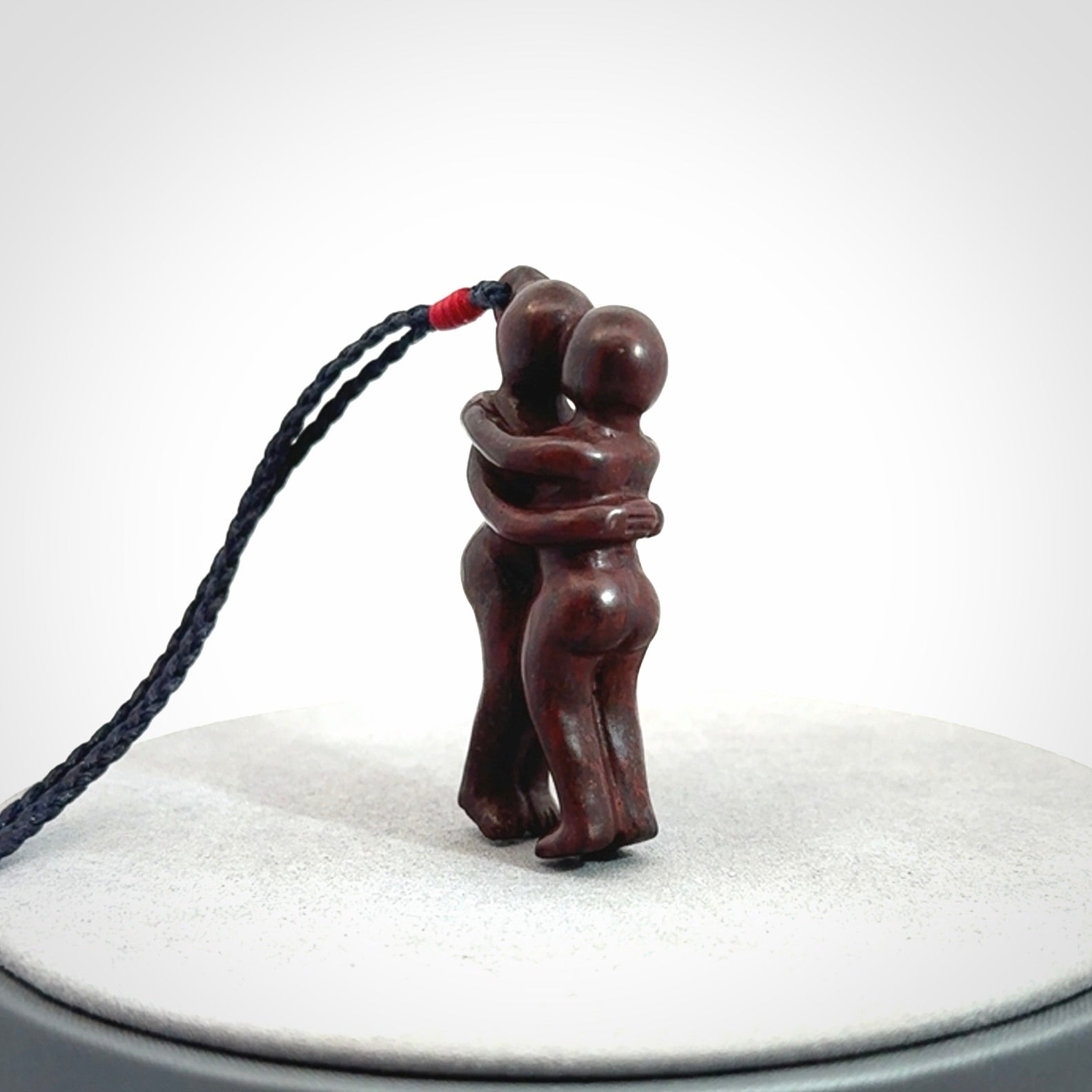 Hand carved Jasper hugging couple pendant