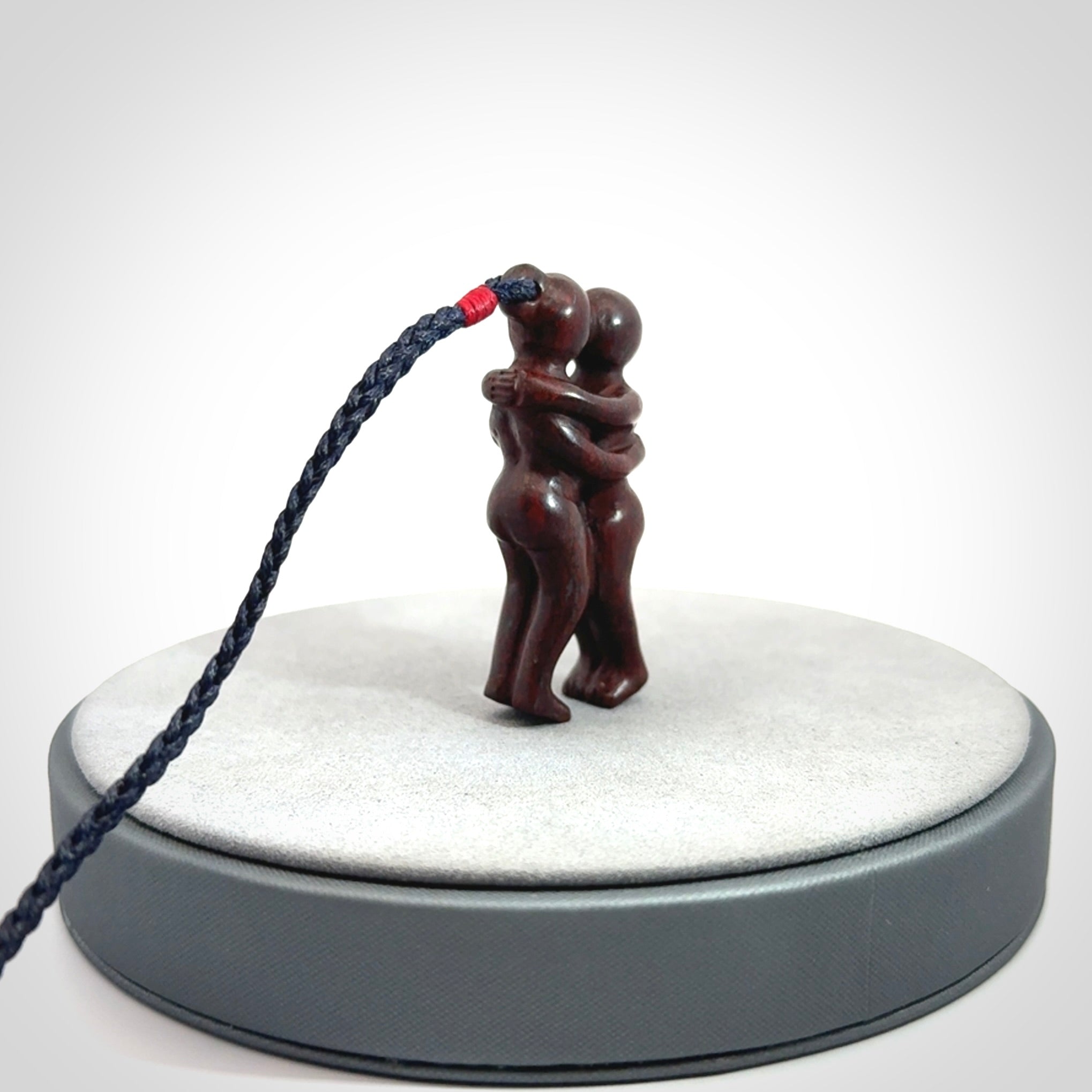 Hand carved Jasper hugging couple pendant