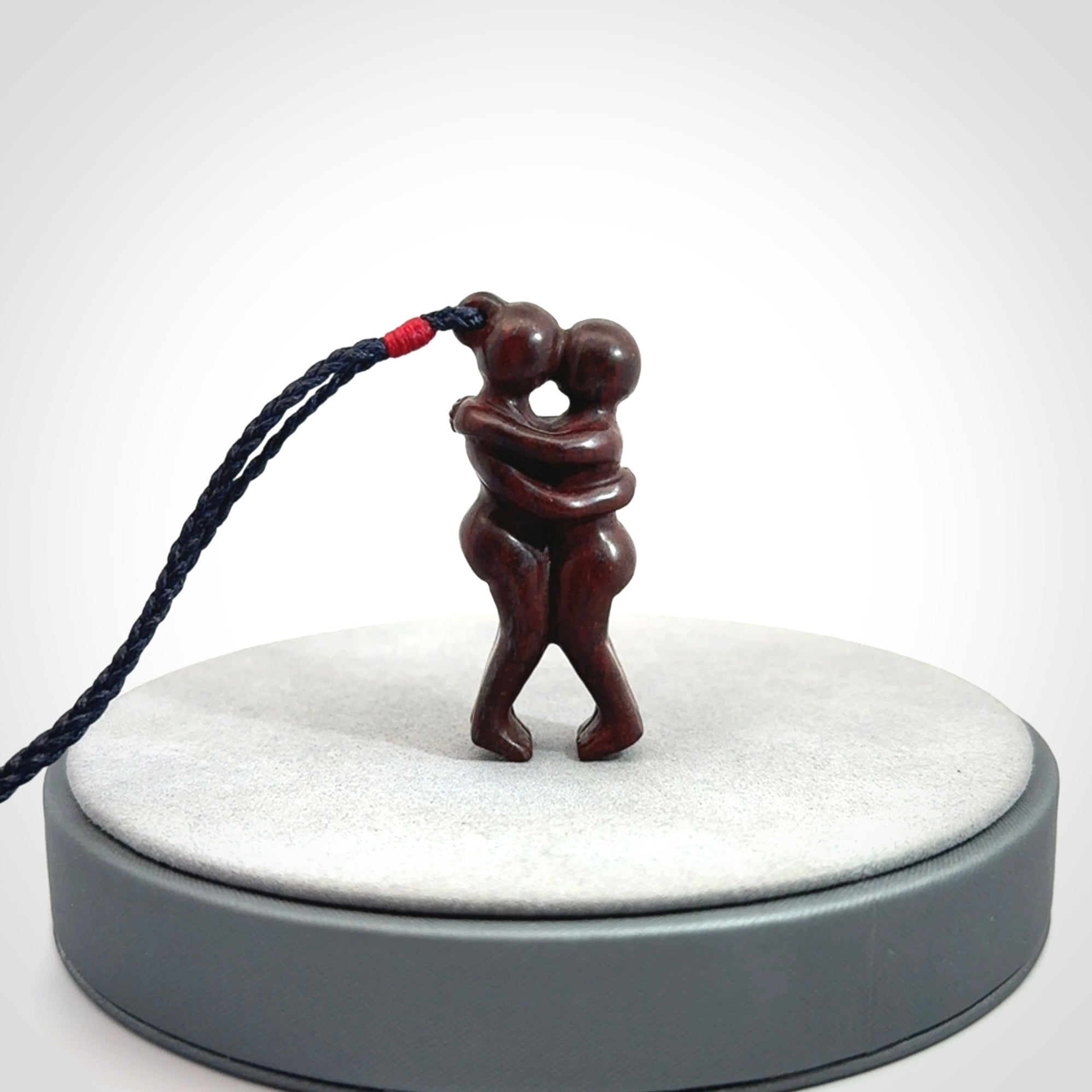 Hand carved Jasper hugging couple pendant