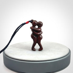 Hand carved Jasper hugging couple pendant