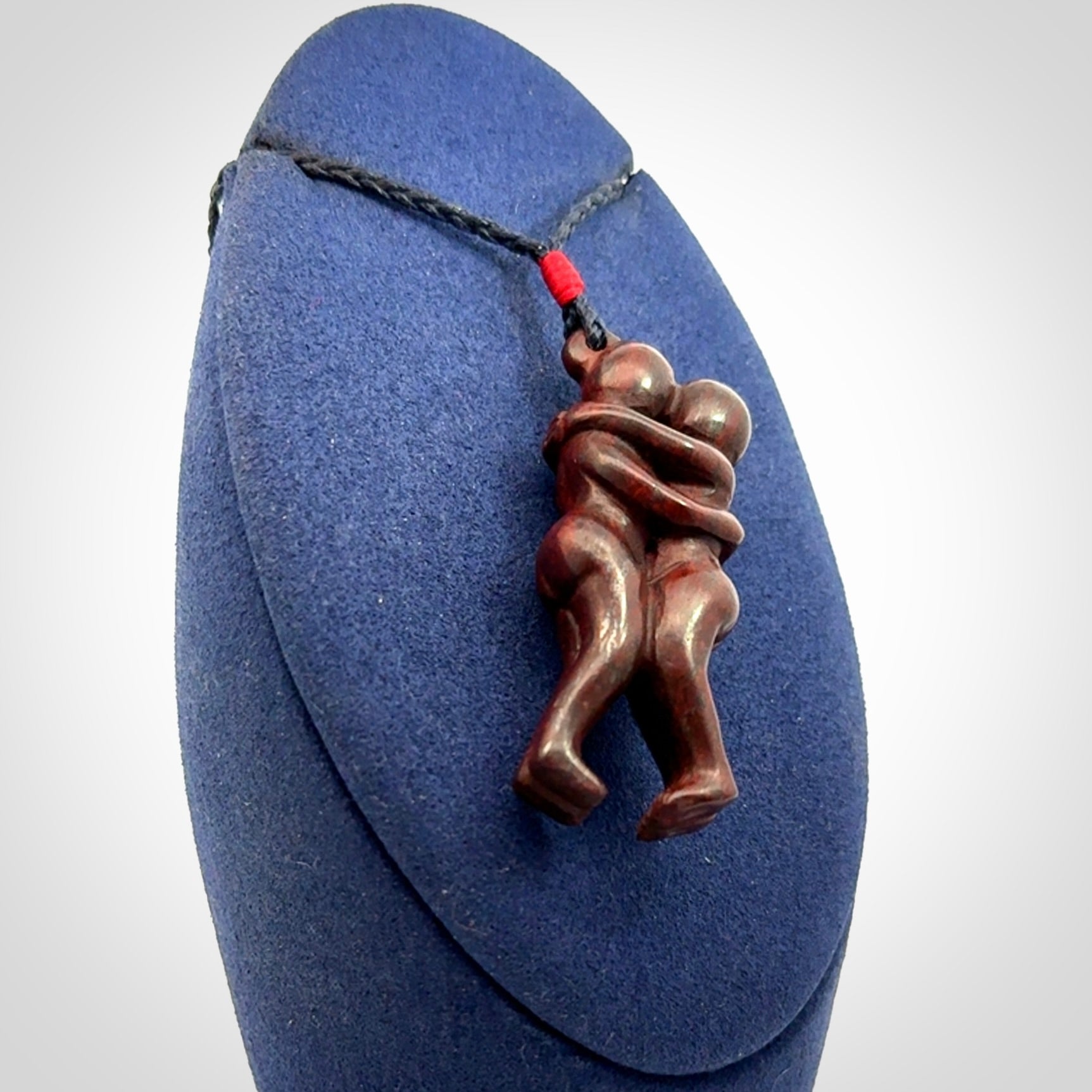 Hand carved Jasper hugging couple pendant