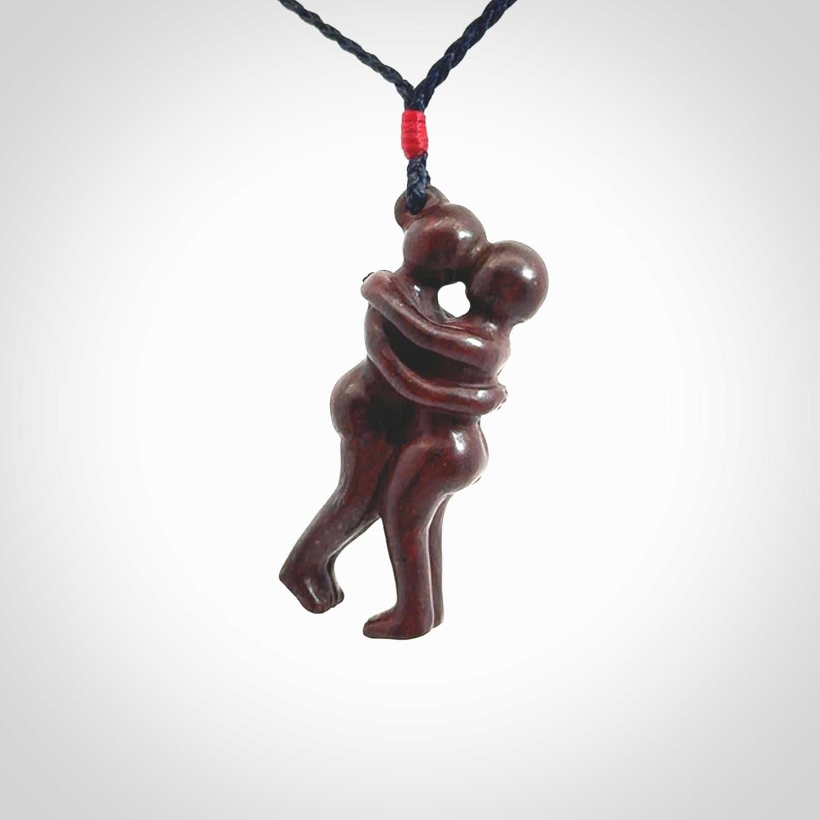 Hand carved Jasper hugging couple pendant