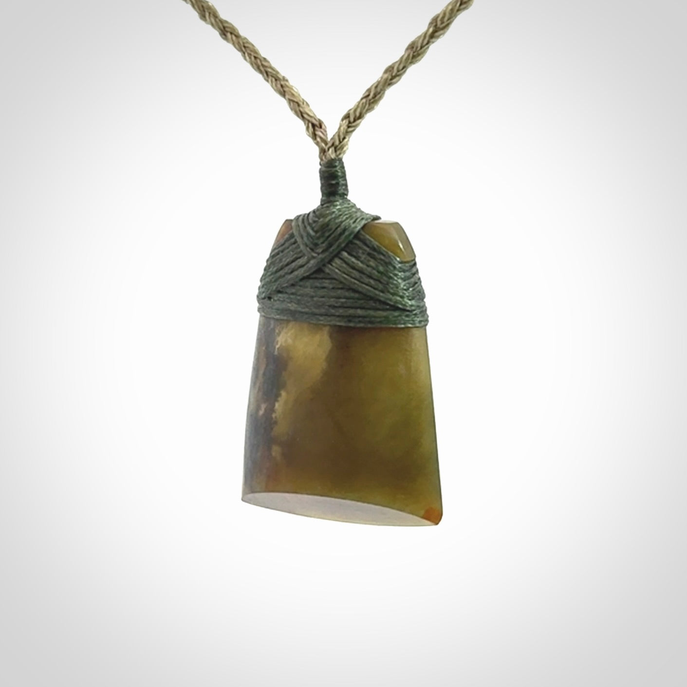 Hand carved toki pendant in a mysterious and beautiful piece of jade