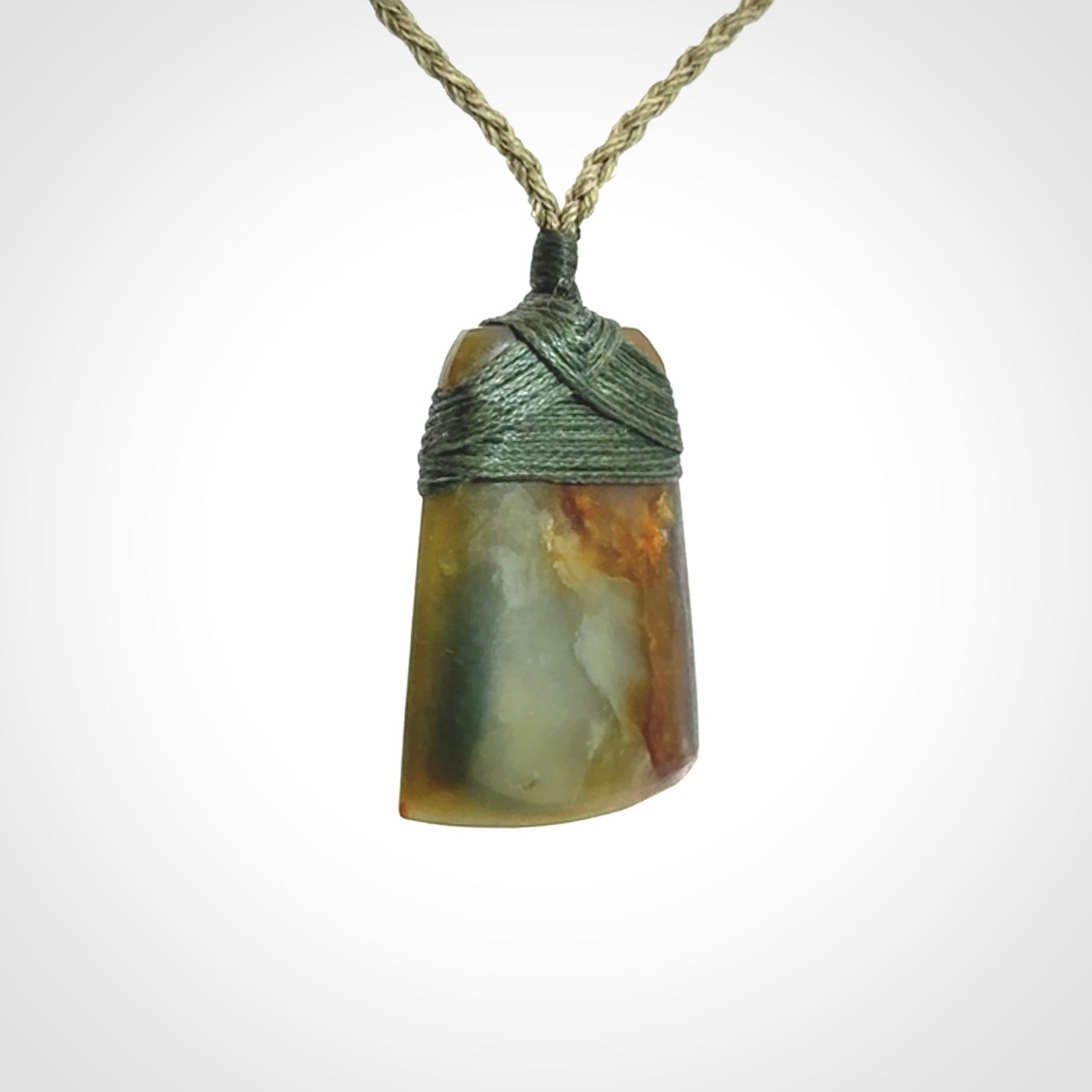 Hand carved toki pendant in a mysterious and beautiful piece of jade