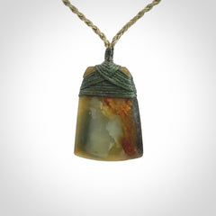 Hand carved toki pendant in a mysterious and beautiful piece of jade
