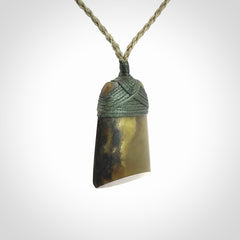 Hand carved toki pendant in a mysterious and beautiful piece of jade