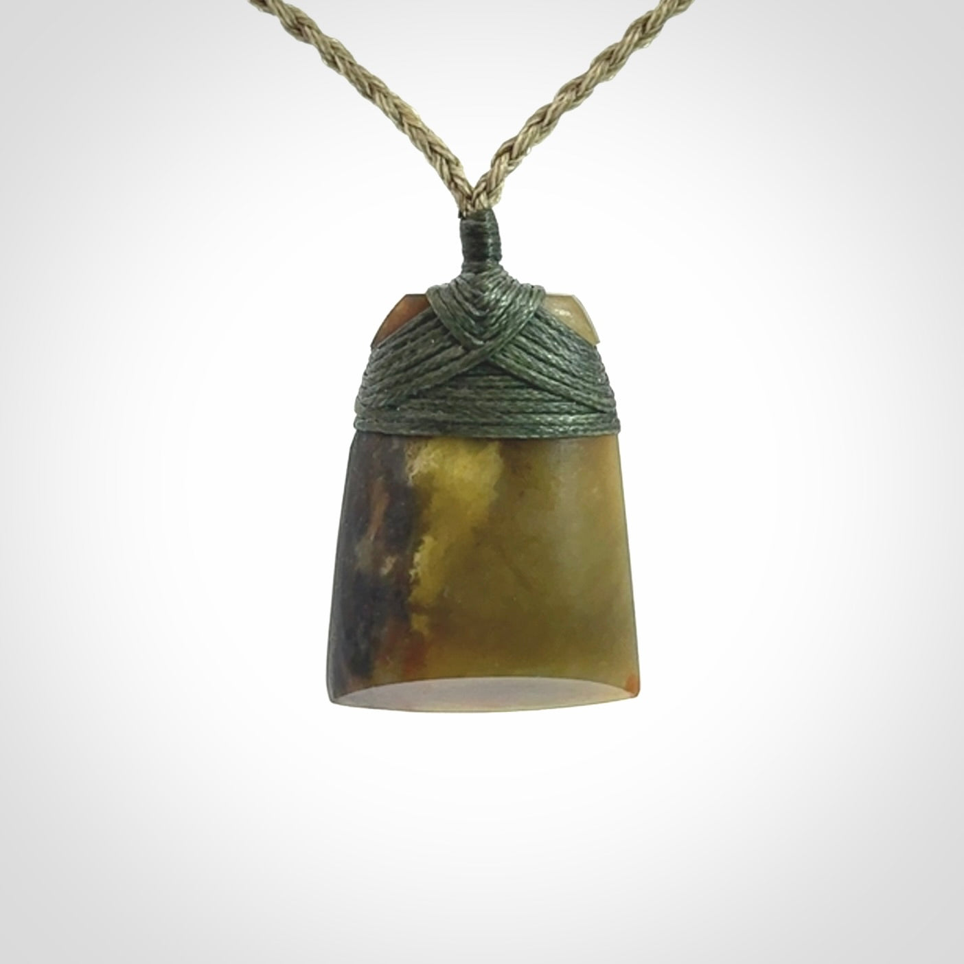 Hand carved toki pendant in a mysterious and beautiful piece of jade
