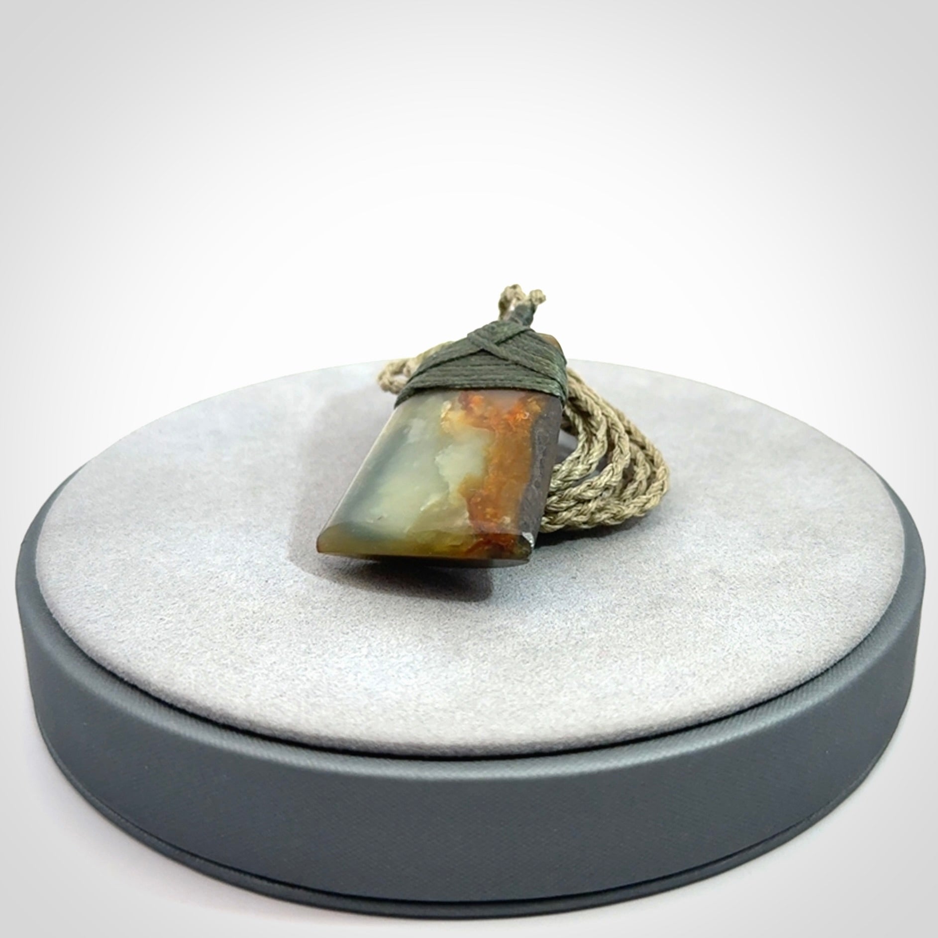 Hand carved toki pendant in a mysterious and beautiful piece of jade