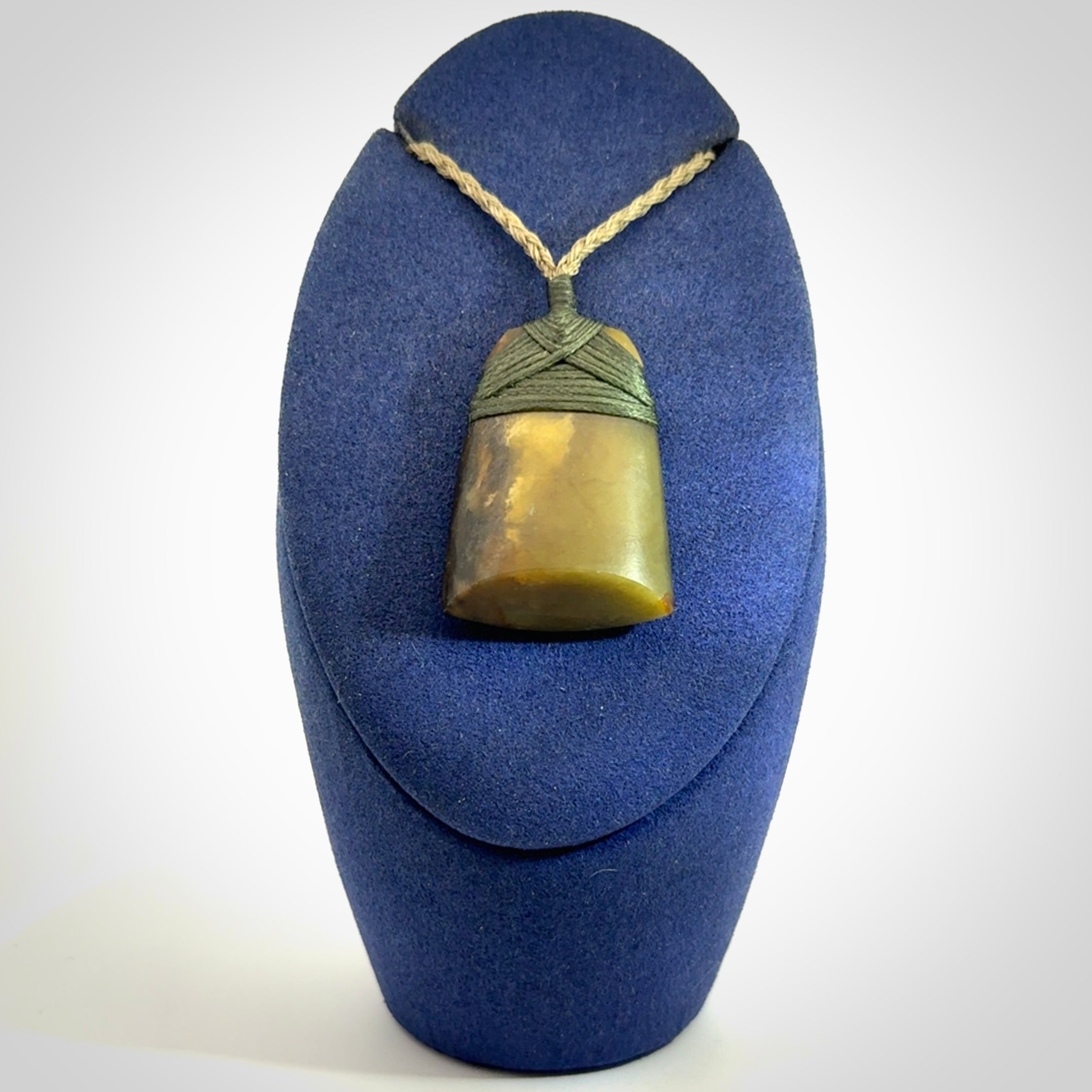 Hand carved toki pendant in a mysterious and beautiful piece of jade