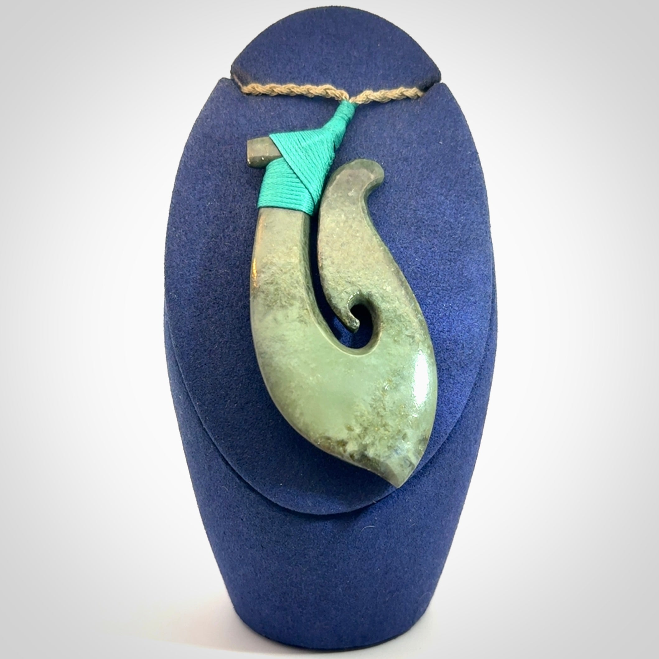 A Strong Matau Pendant Beautifully Carved and Visually Arresting. Carved in New Zealand Jade.