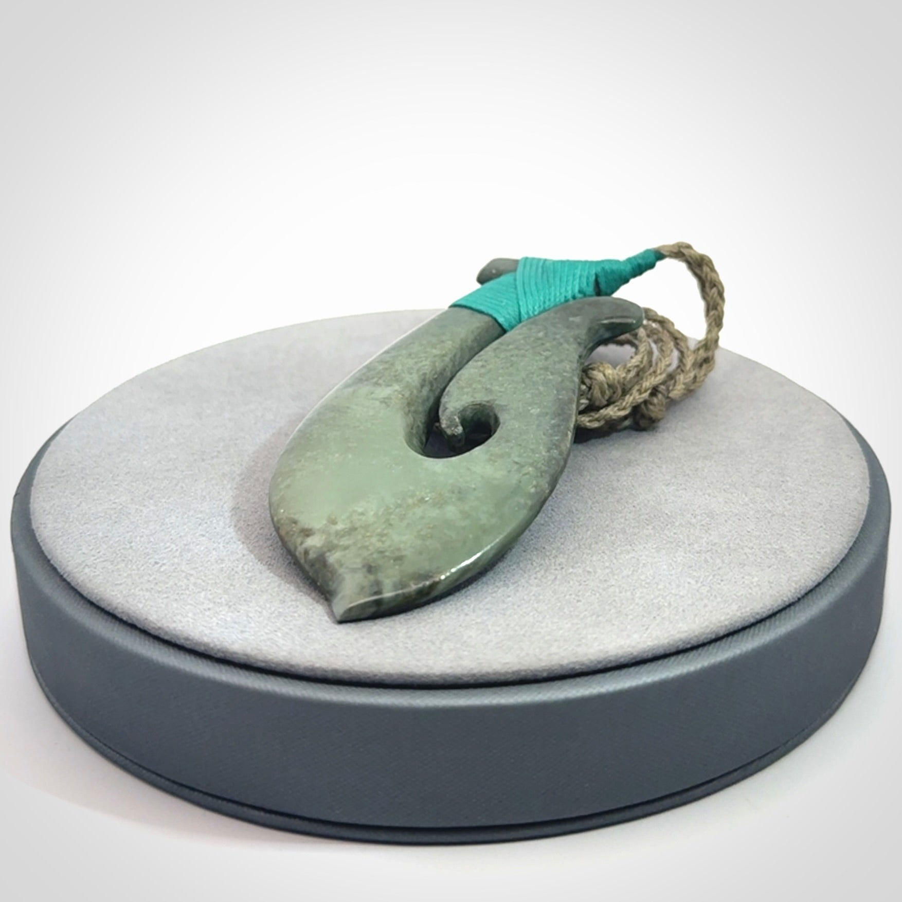 A Strong Matau Pendant Beautifully Carved and Visually Arresting. Carved in New Zealand Jade.