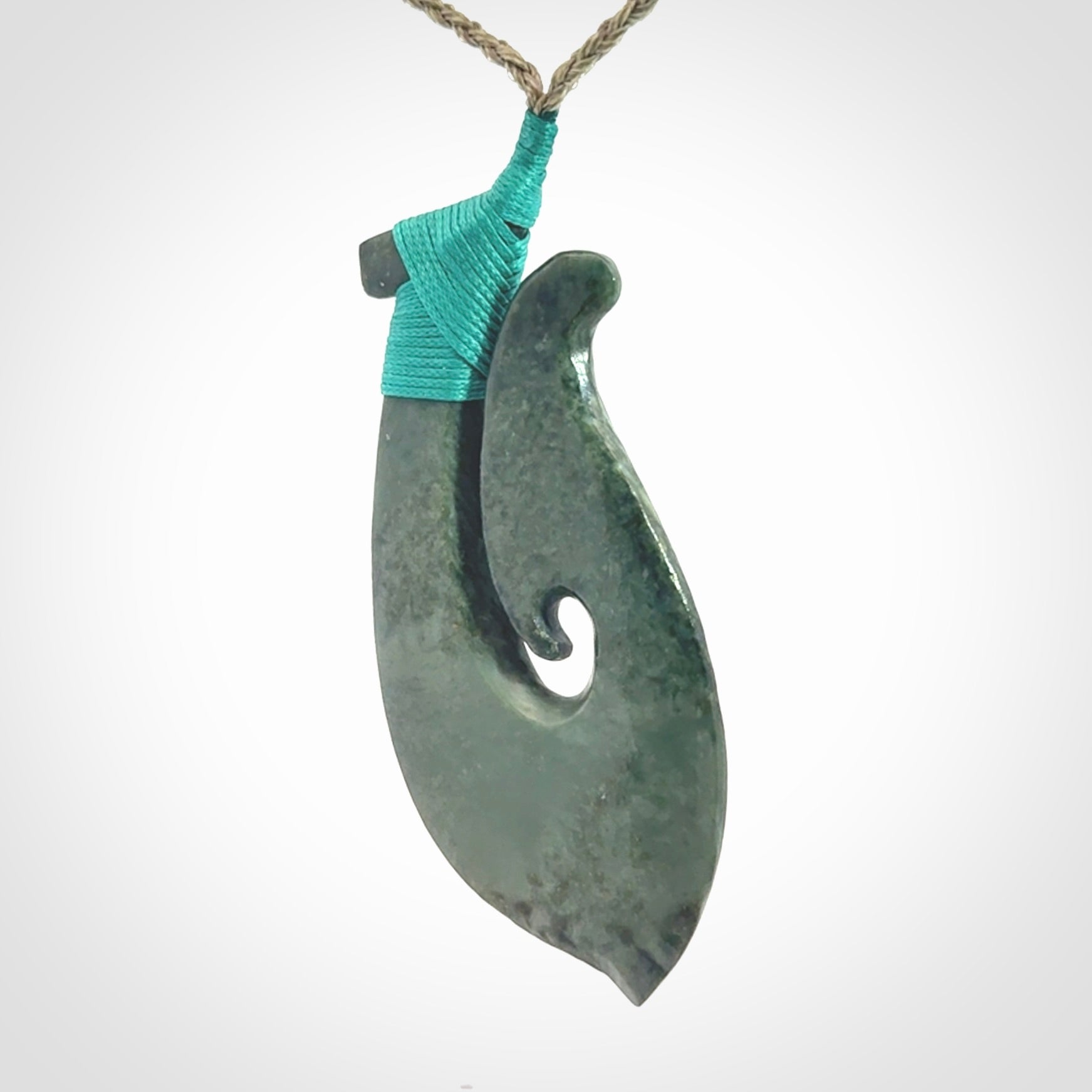A Strong Matau Pendant Beautifully Carved and Visually Arresting. Carved in New Zealand Jade.