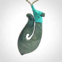 A Strong Matau Pendant Beautifully Carved and Visually Arresting. Carved in New Zealand Jade.