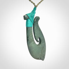 A Strong Matau Pendant Beautifully Carved and Visually Arresting. Carved in New Zealand Jade.
