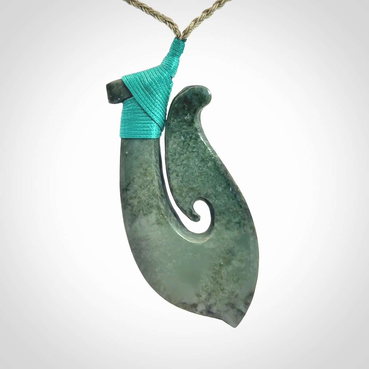 A Strong Matau Pendant Beautifully Carved and Visually Arresting. Carved in New Zealand Jade.