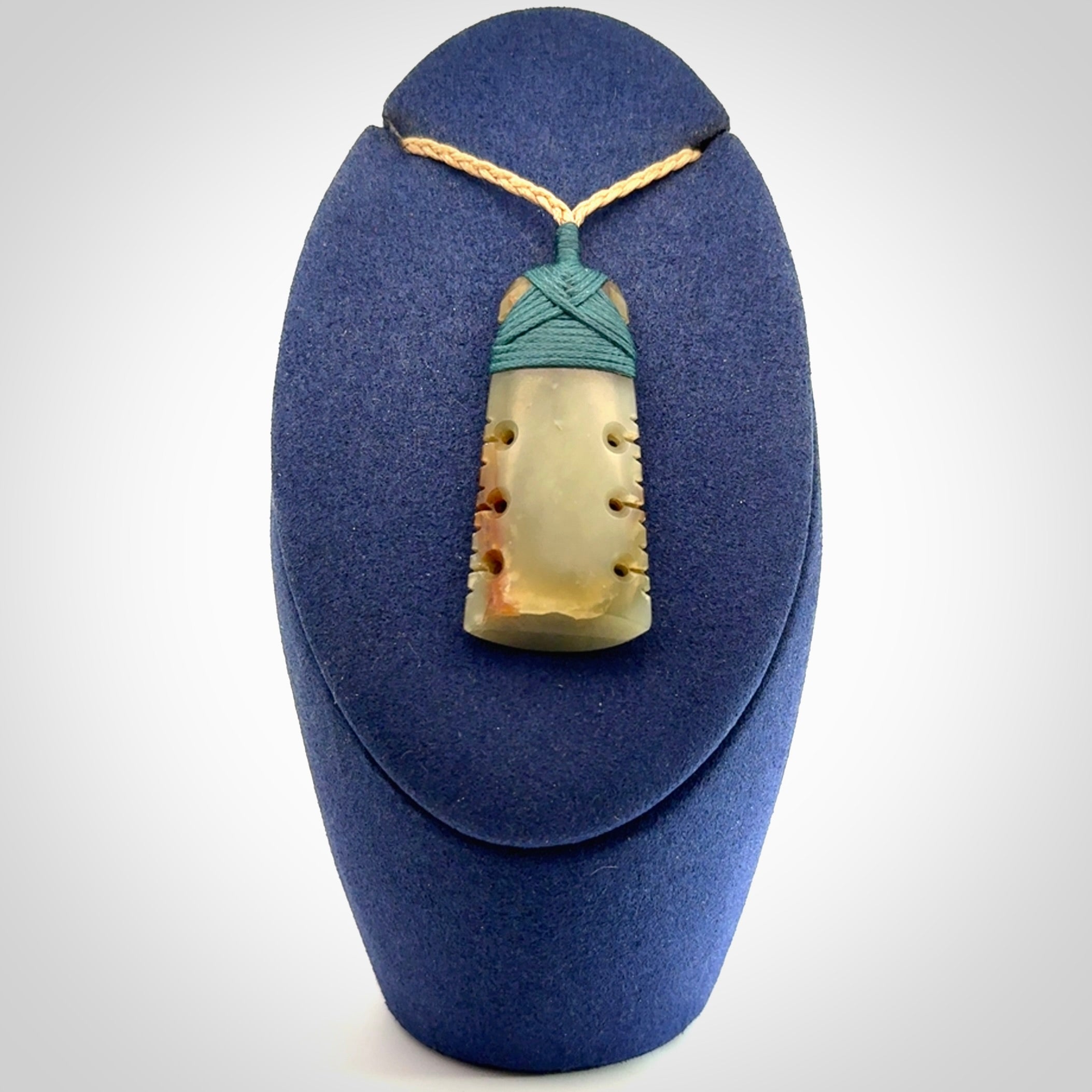 A beautiful, notched, New Zealand jade toki pendant