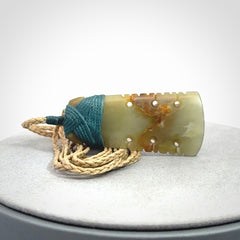 A beautiful, notched, New Zealand jade toki pendant
