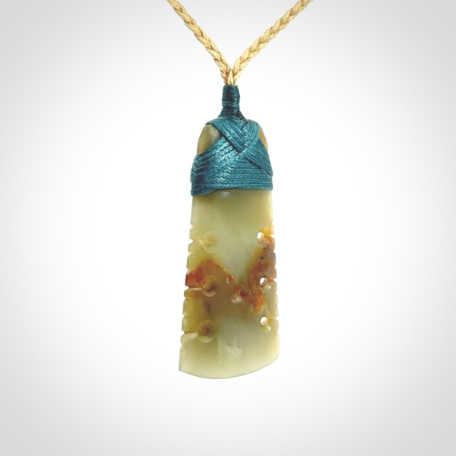 A beautiful, notched, New Zealand jade toki pendant