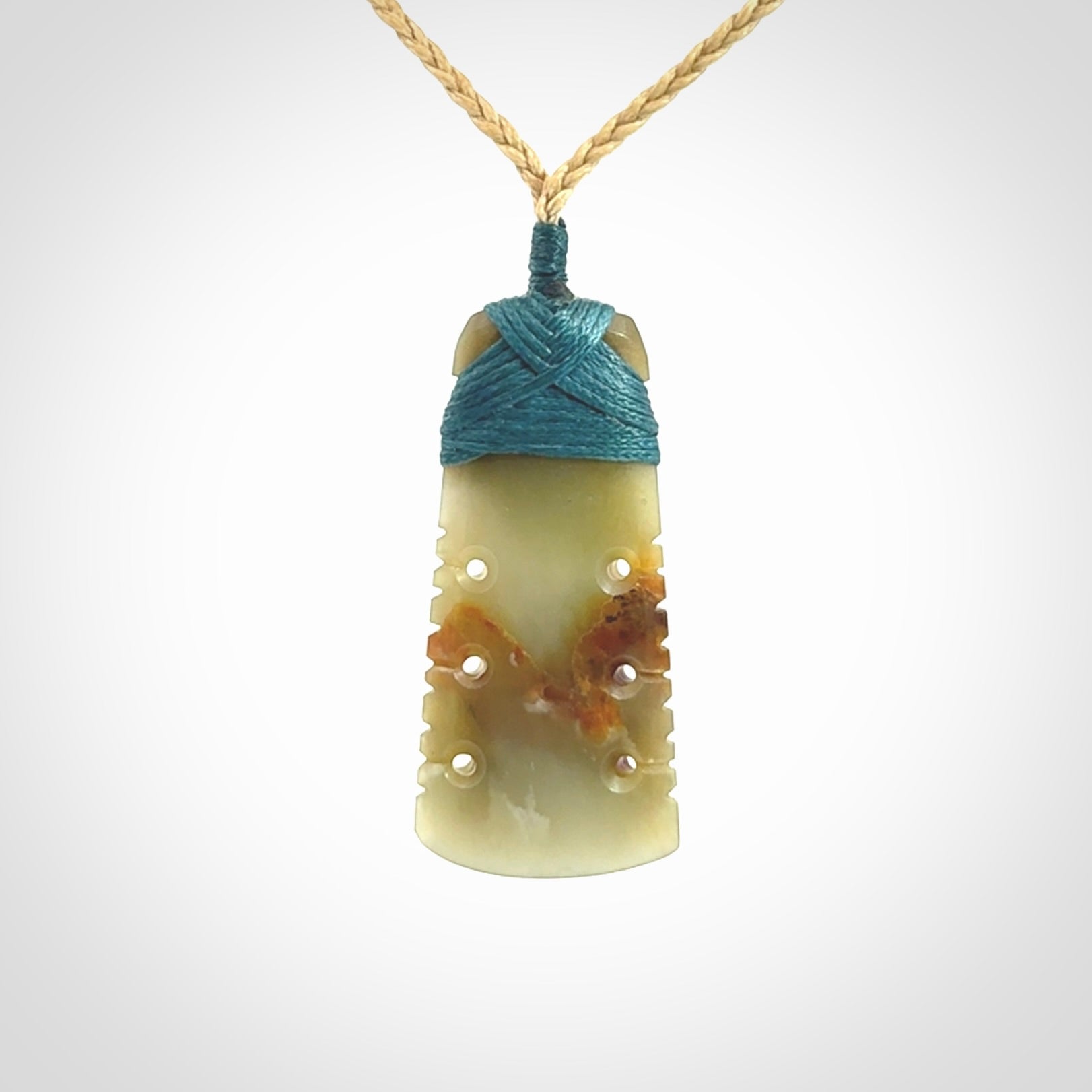 A beautiful, notched, New Zealand jade toki pendant