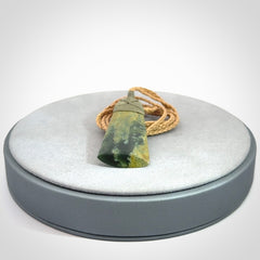 A gorgeous flower jade toki pendant