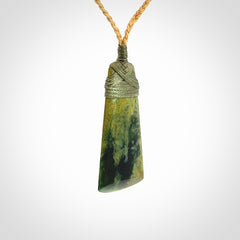 A gorgeous flower jade toki pendant